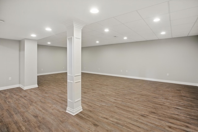 finished below grade area with baseboards, recessed lighting, and wood finished floors