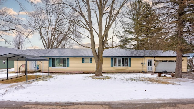 ranch-style home with a detached carport and metal roof