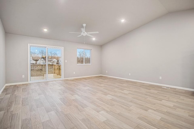spare room featuring ceiling fan, baseboards, lofted ceiling, recessed lighting, and light wood-style flooring