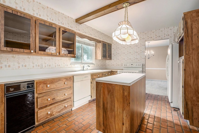 kitchen featuring white appliances, wallpapered walls, a center island, brick floor, and a sink