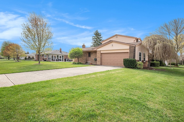 view of front facade featuring an attached garage, a front lawn, brick siding, a chimney, and driveway