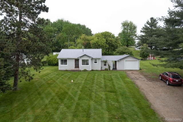 968 N Wilder Rd, Lapeer, MI 48446 - single story home with dirt driveway, a front yard, and metal roof