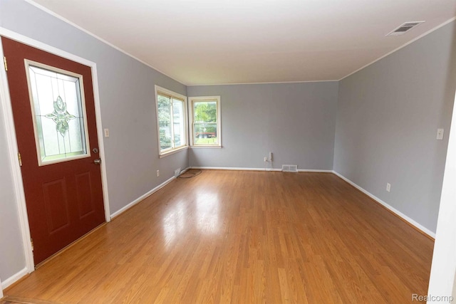 968 N Wilder Rd, Lapeer, MI 48446 - entryway featuring light wood-style flooring, ornamental molding, and baseboards