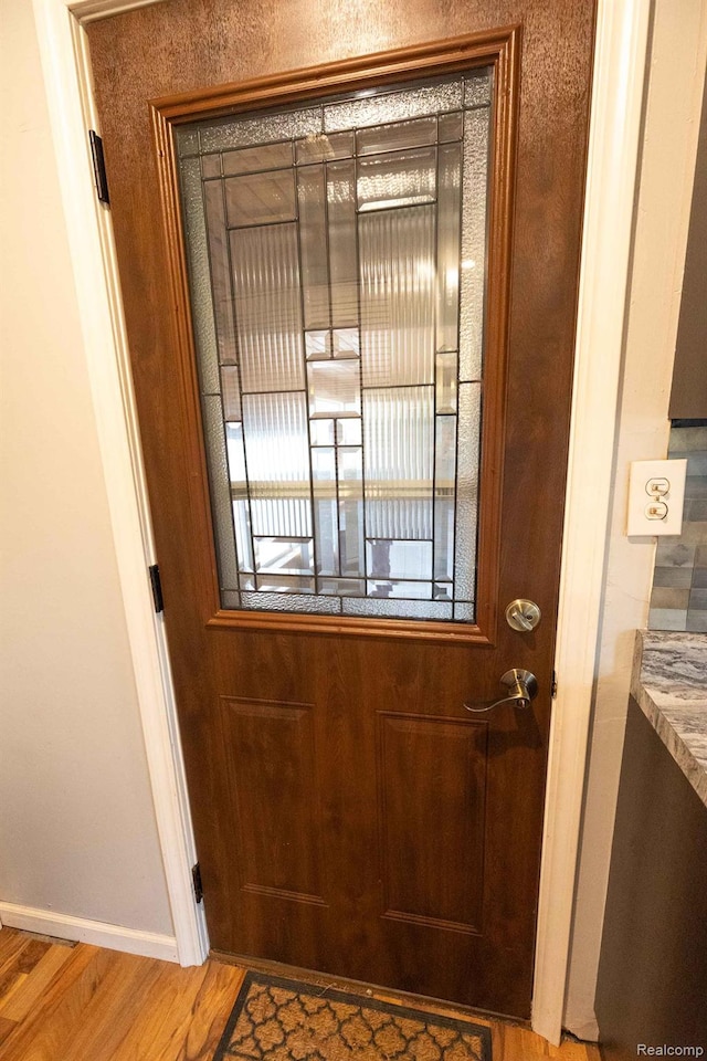 968 N Wilder Rd, Lapeer, MI 48446 - doorway featuring wood finished floors and baseboards