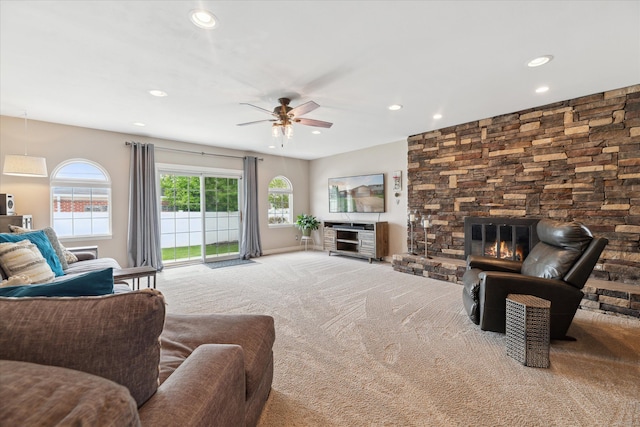 living room with carpet floors, ceiling fan, a fireplace, and recessed lighting