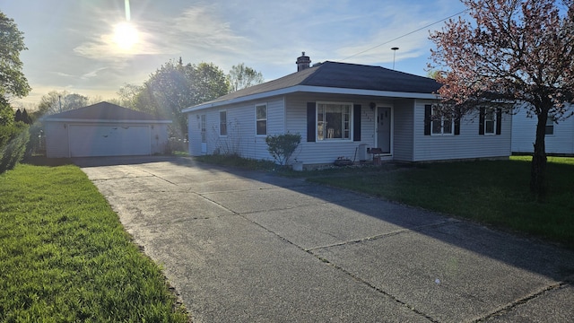 view of front of house with a garage, an outdoor structure, a chimney, and a front lawn