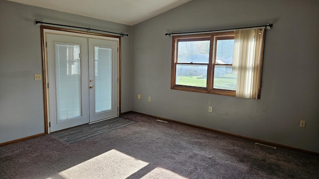 doorway to outside featuring baseboards, lofted ceiling, french doors, and carpet