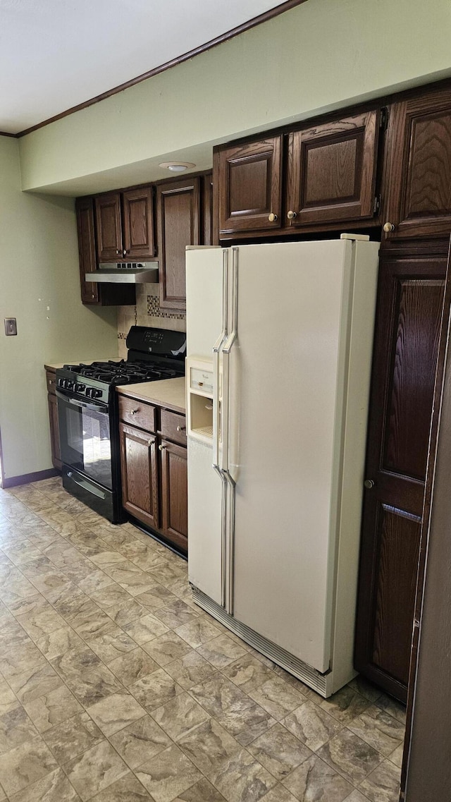 kitchen featuring white refrigerator with ice dispenser, dark brown cabinets, light countertops, black gas range oven, and under cabinet range hood