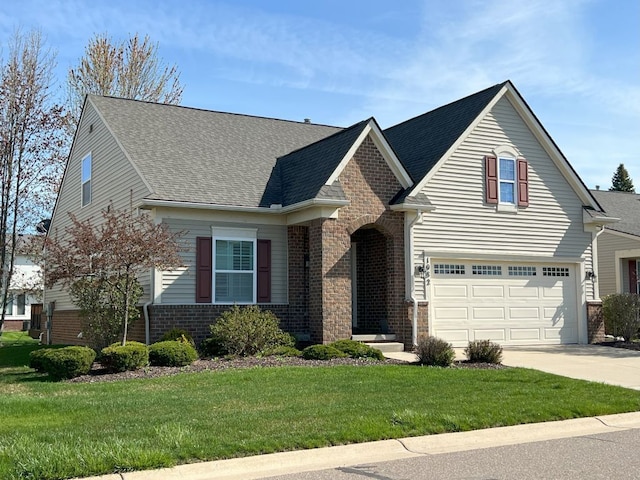 1082 Paddock Dr Unit 78, South Lyon, MI 48178 - view of front of property with a front lawn, roof with shingles, brick siding, concrete driveway, and an attached garage