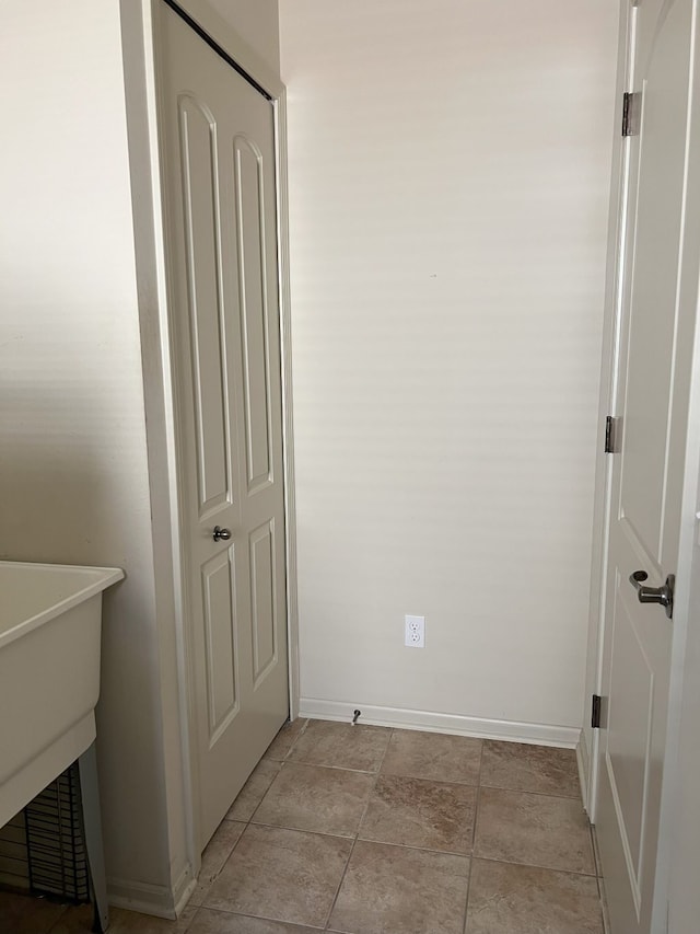 1082 Paddock Dr Unit 78, South Lyon, MI 48178 - interior space featuring baseboards and a sink