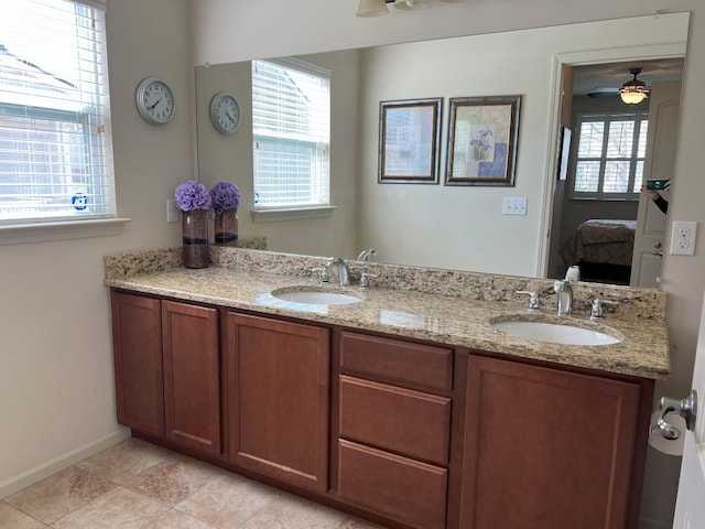 1082 Paddock Dr Unit 78, South Lyon, MI 48178 - ensuite bathroom featuring double vanity, a ceiling fan, a sink, and ensuite bathroom