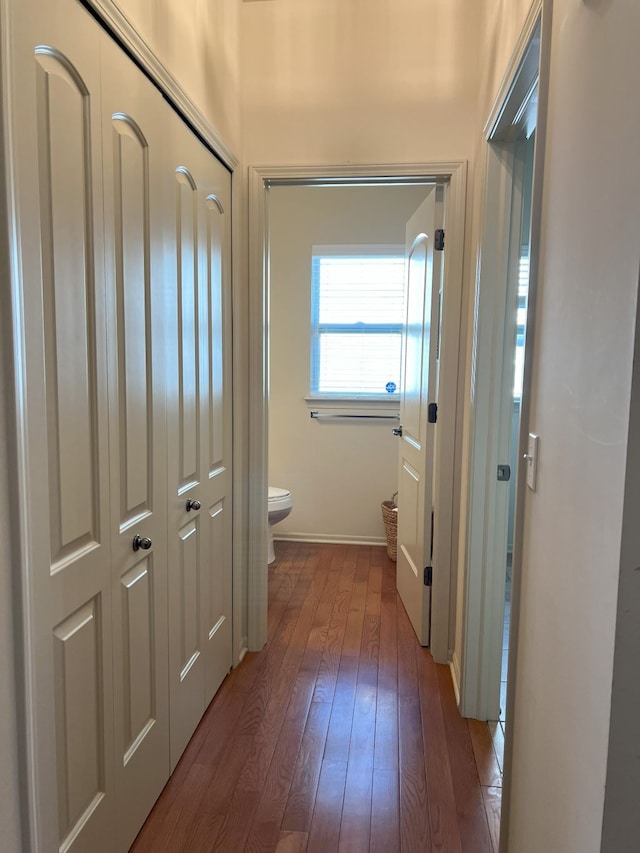 1082 Paddock Dr Unit 78, South Lyon, MI 48178 - bathroom featuring baseboards, toilet, and hardwood / wood-style floors