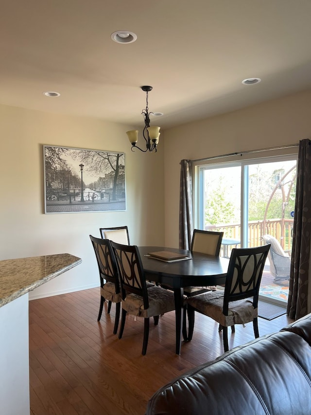 1082 Paddock Dr Unit 78, South Lyon, MI 48178 - dining room featuring recessed lighting, dark wood finished floors, and a notable chandelier