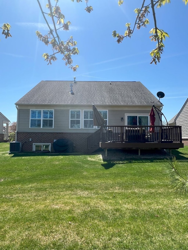1082 Paddock Dr Unit 78, South Lyon, MI 48178 - rear view of property with a yard, a wooden deck, and central air condition unit