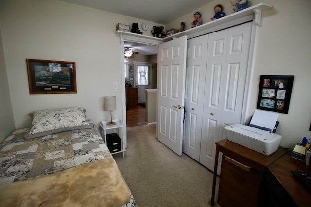 carpeted bedroom with a closet