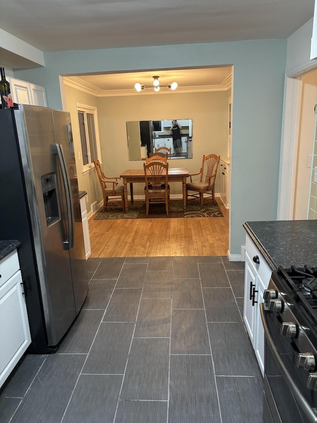dining area featuring crown molding, baseboards, and dark wood-type flooring