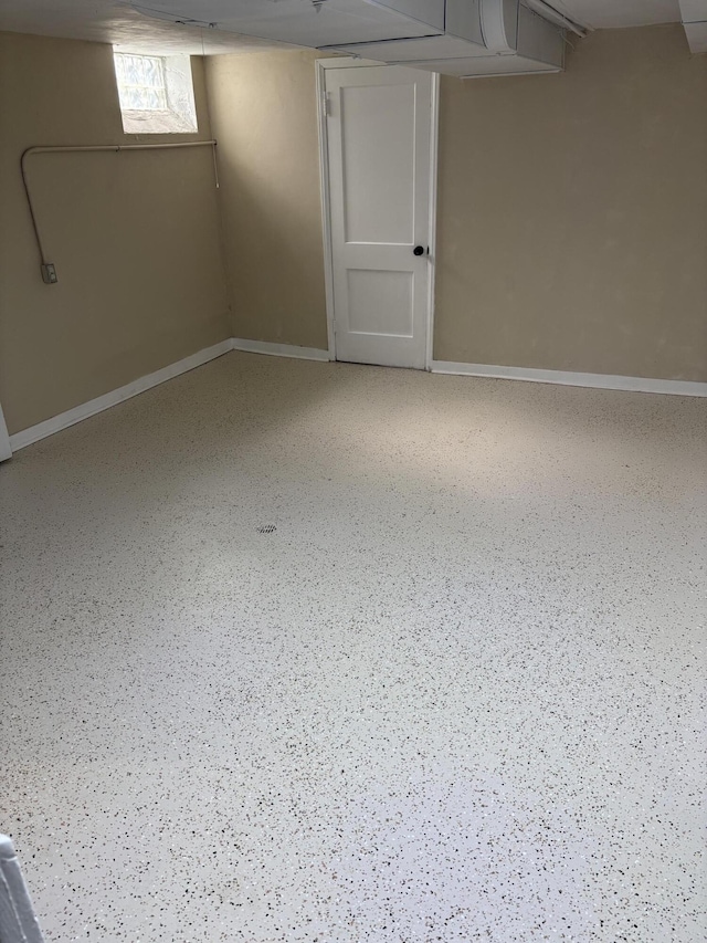 basement featuring baseboards