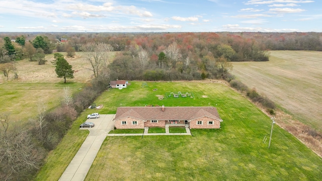bird's eye view featuring a forest view and a rural view