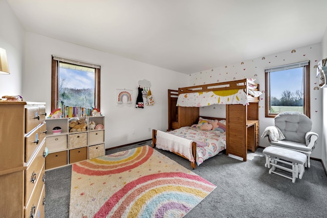 carpeted bedroom with multiple windows