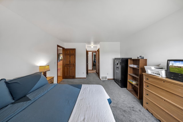 bedroom featuring light carpet and visible vents