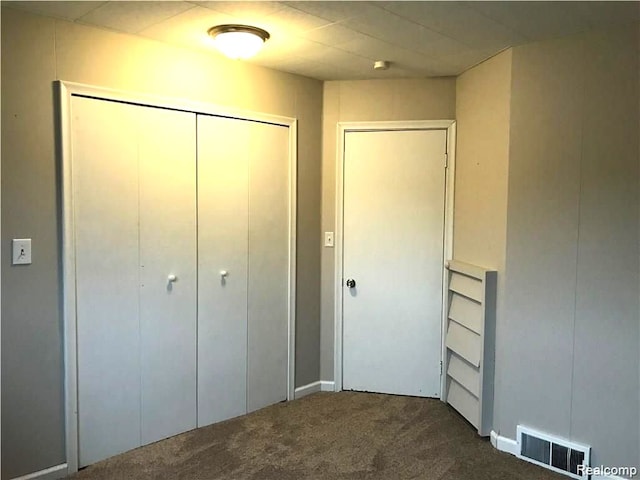 8404 Westminster Ave, Warren, MI 48089 - unfurnished bedroom with dark colored carpet and a closet