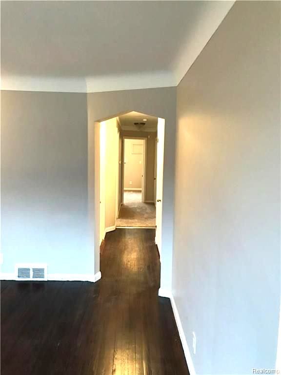 8404 Westminster Ave, Warren, MI 48089 - hallway with dark wood finished floors and baseboards