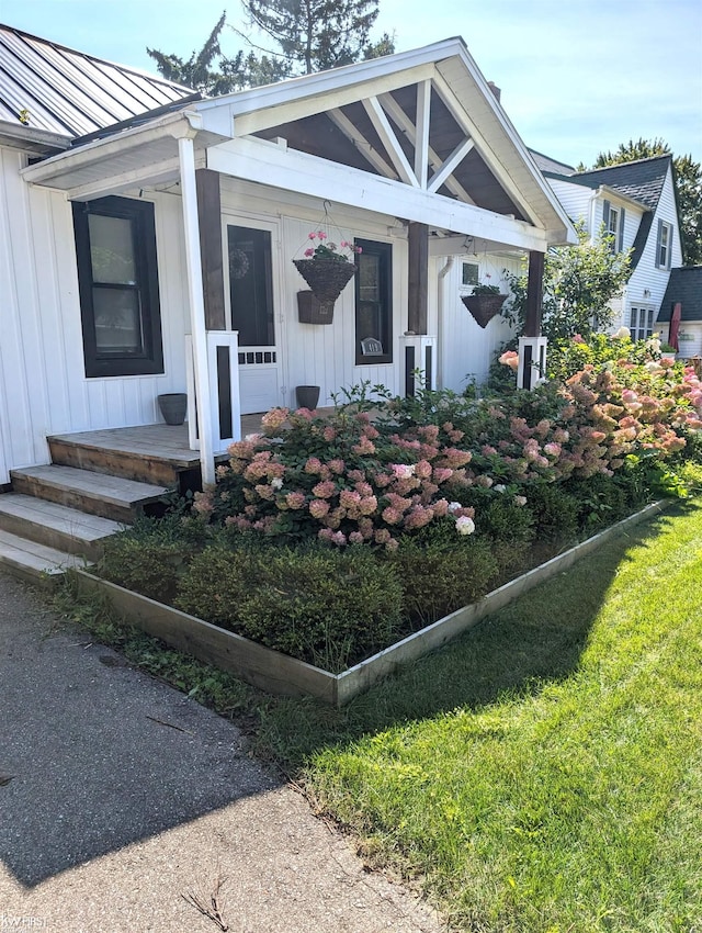 view of front of property featuring board and batten siding and metal roof