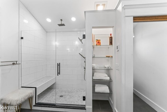 bathroom featuring baseboards, tile patterned flooring, a shower stall, and recessed lighting