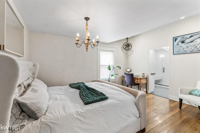 bedroom featuring wood-type flooring and a notable chandelier
