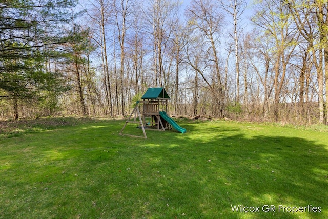 view of playground with a yard