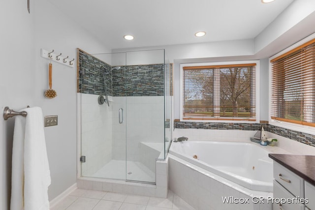 full bath with a jetted tub, tile patterned flooring, a shower stall, vanity, and recessed lighting