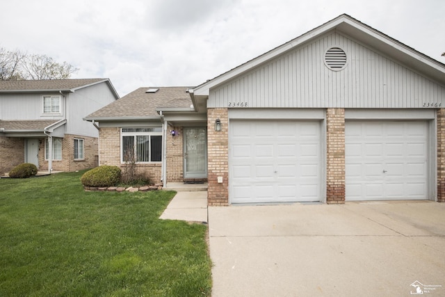 view of front of property featuring a shingled roof, a front lawn, brick siding, a garage, and driveway