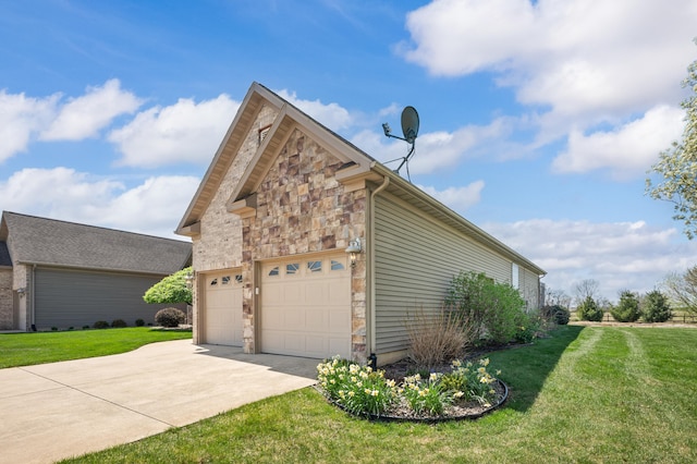 view of side of property featuring a garage, a yard, stone siding, and concrete driveway