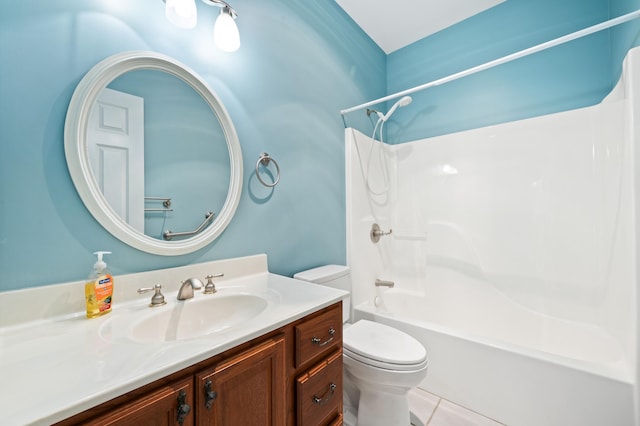bathroom featuring toilet, tile patterned floors, washtub / shower combination, and vanity