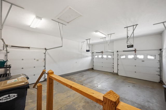 garage with baseboards and a garage door opener