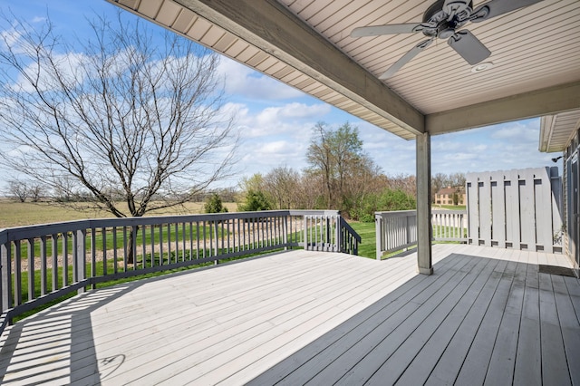 wooden terrace with a yard and a ceiling fan