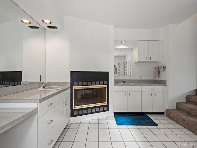 5620 Eastman Blvd, West Bloomfield, MI 48323 - kitchen with a sink, white cabinets, light countertops, and recessed lighting