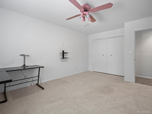 5620 Eastman Blvd, West Bloomfield, MI 48323 - unfurnished bedroom with carpet, a closet, baseboards, and a ceiling fan