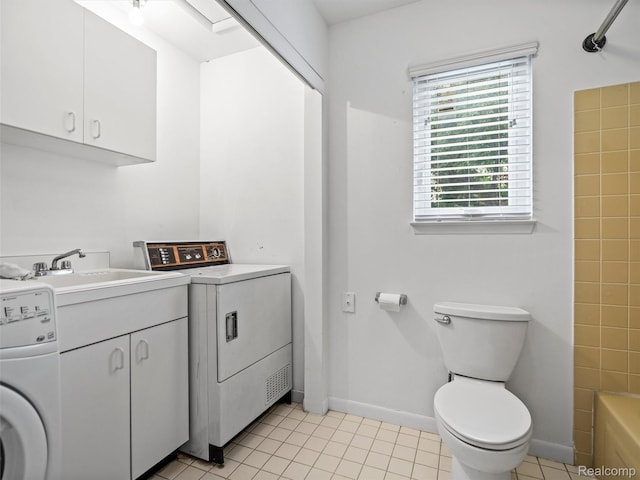 5620 Eastman Blvd, West Bloomfield, MI 48323 - laundry area with washer / dryer, light tile patterned floors, and baseboards