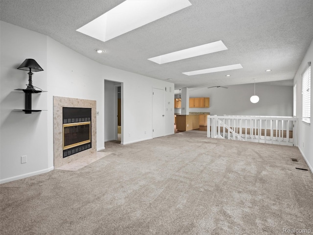 5620 Eastman Blvd, West Bloomfield, MI 48323 - unfurnished living room with a skylight, a premium fireplace, a textured ceiling, carpet, and baseboards