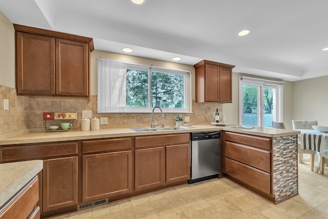 27610 Denmar Dr, Warren, MI 48093 - kitchen featuring a sink, light countertops, a peninsula, stainless steel dishwasher, and visible vents
