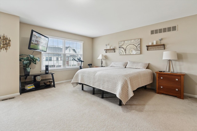 bedroom with visible vents, carpet, and baseboards
