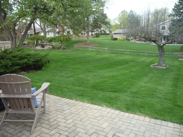 view of yard with fence and a patio area