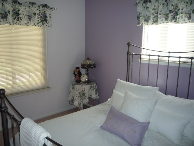 bedroom featuring baseboards