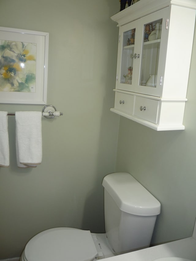 half bath featuring toilet