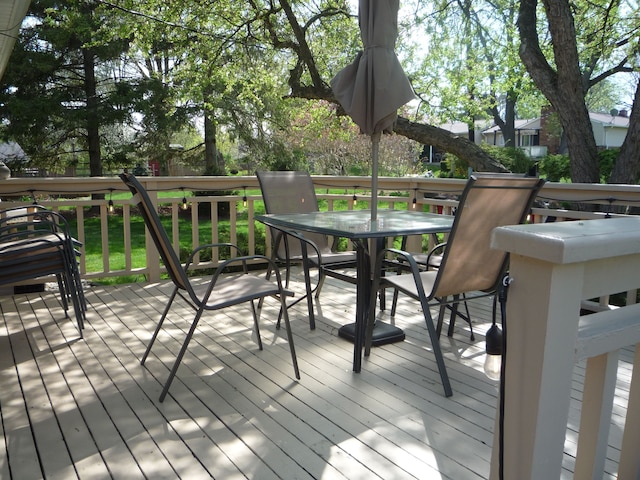 wooden deck featuring outdoor dining space