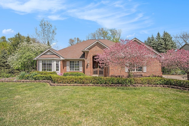 2053 Channel Dr, Brighton, MI 48114 - single story home featuring brick siding and a front yard