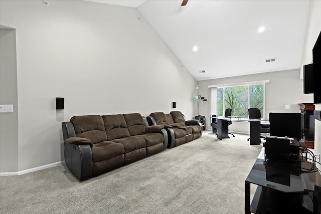 living area with carpet floors, baseboards, visible vents, and high vaulted ceiling