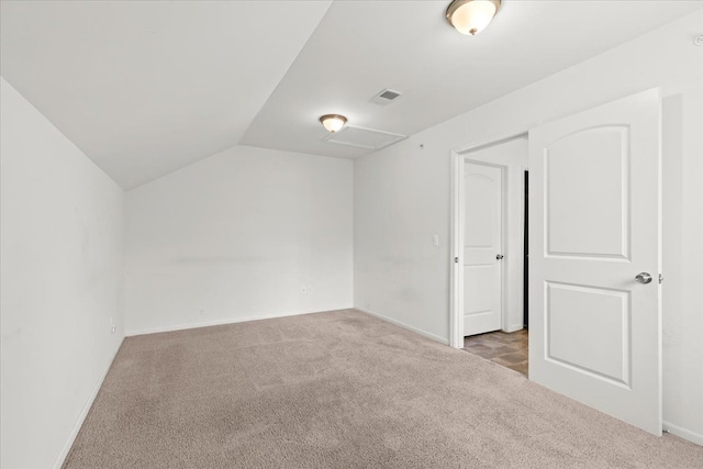 bonus room with carpet floors, baseboards, visible vents, and lofted ceiling