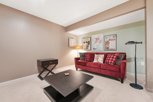 carpeted living room with baseboards